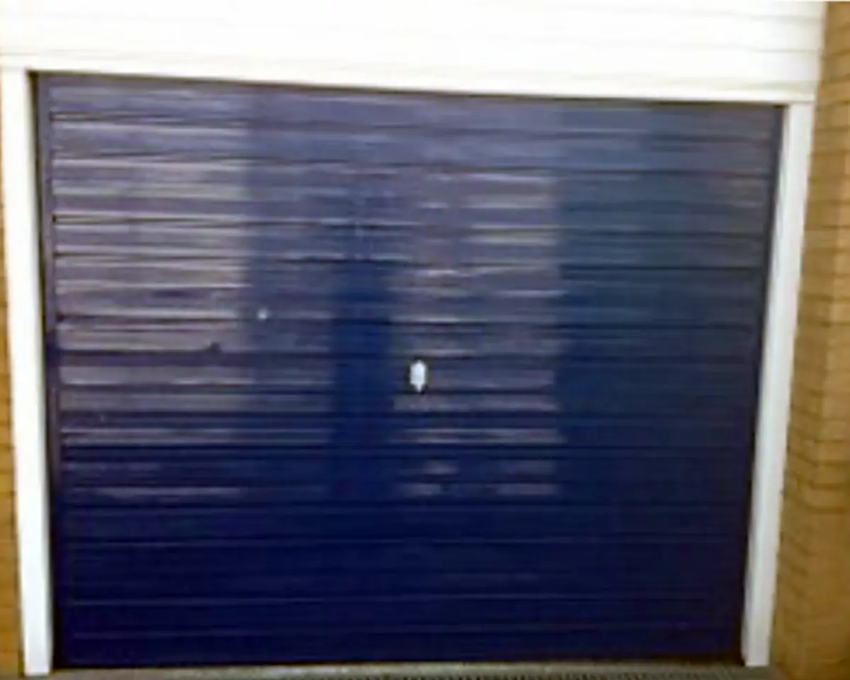 The same blue ribbed door closed and sitting square in its frame